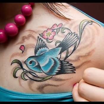 Blue Ink Sparrow Tattoo On Collar Bone