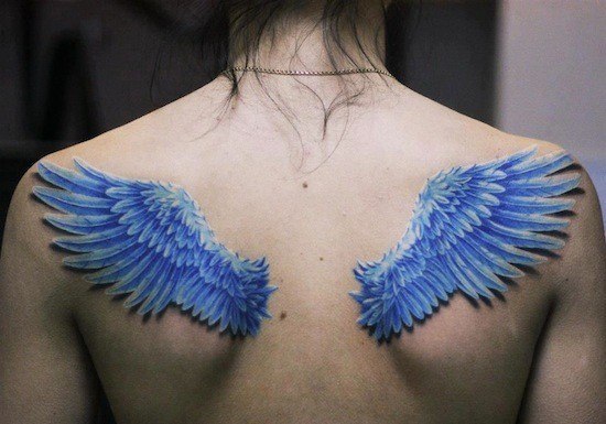 Blue Ink Wings Tattoo On Upper Back