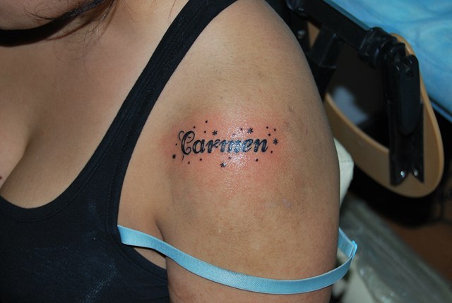Carmen Name Tattoo On Girl Left Shoulder