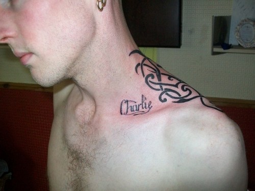 Charlie Name Tattoo On Man Left Upper Shoulder