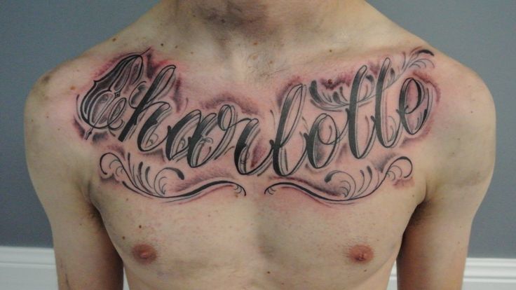 Charlotte Name Tattoo On Man Chest By Lou Shaw
