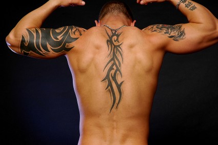 Classic Black Tribal Design Tattoo On Man Upper Back