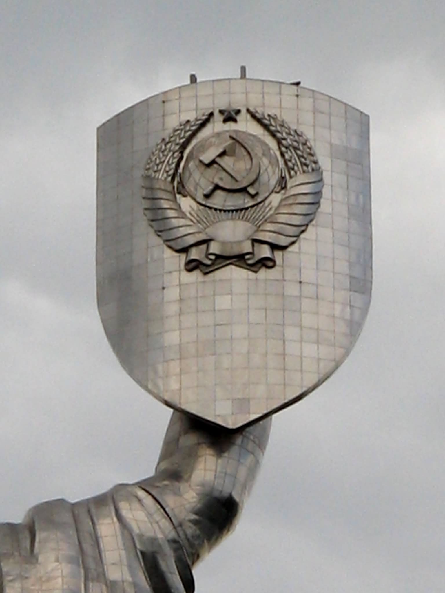 Closeup Of The Shield Of Monument With Soviet Union Emblem Of Mother Motherland