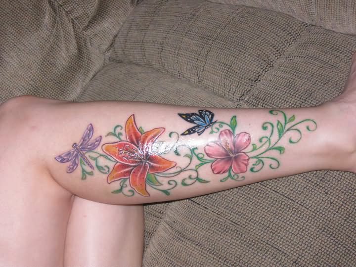 Colorful Flowers With Butterfly Tattoo On Right Leg Calf