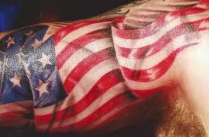Colorful US Flag Tattoo On Bicep