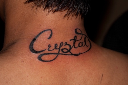 Crystal Name Tattoo On Man Back Neck