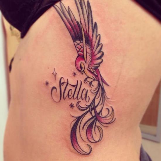 Cute Flying Bird With Stella Name Tattoo On Girl Left Side Rib