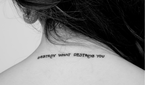 Destroy What Destroys You Quote Tattoo On Girl Back Neck
