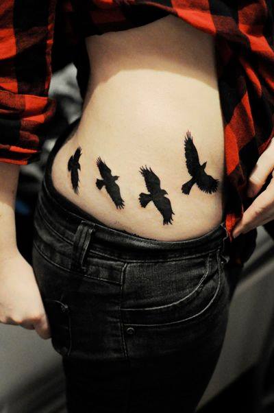 Four Black Crows Flying Tattoos On Side Rib