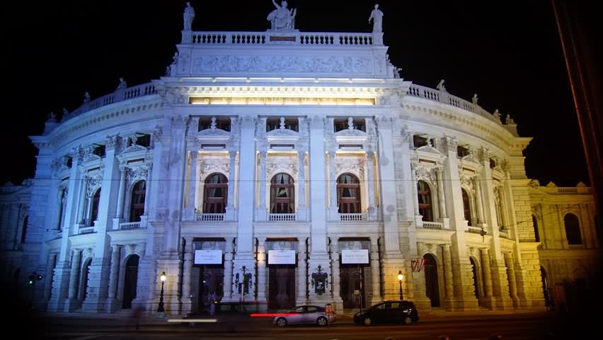 Front Facade Night View Of The Burgtheater In Vienna, Austria
