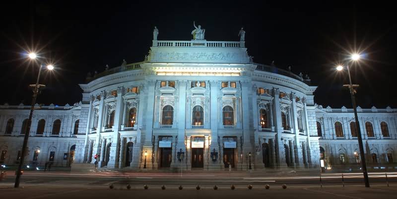 Front Facade Of The Burgtheater In Vienna At Night