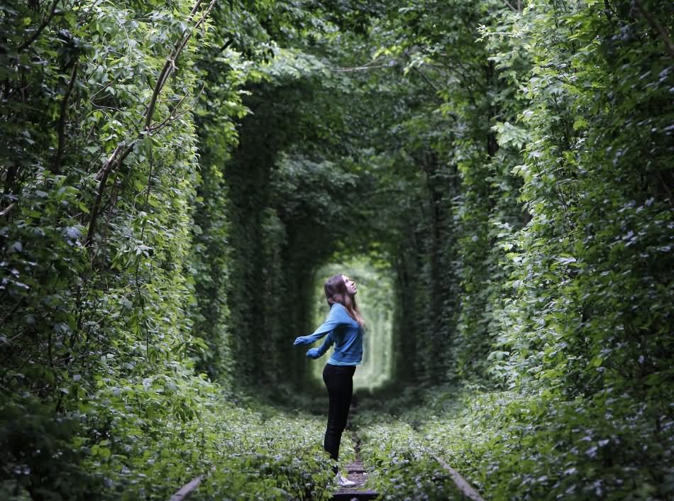 Girl Standing In Tunnel Of Love Picture