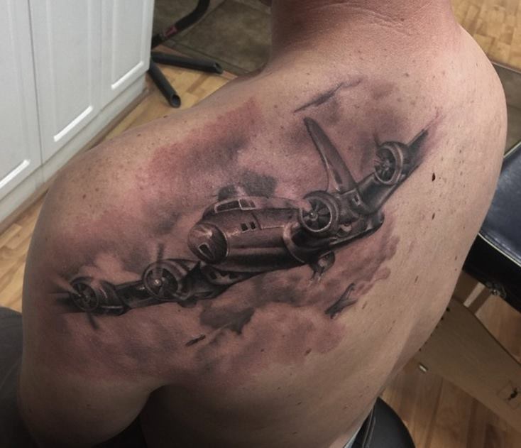 Grey Ink Airplane Tattoo On Left Back Shoulder