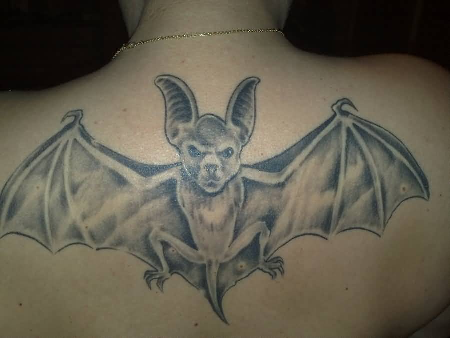 Grey Ink Bat Tattoo On Upper Back