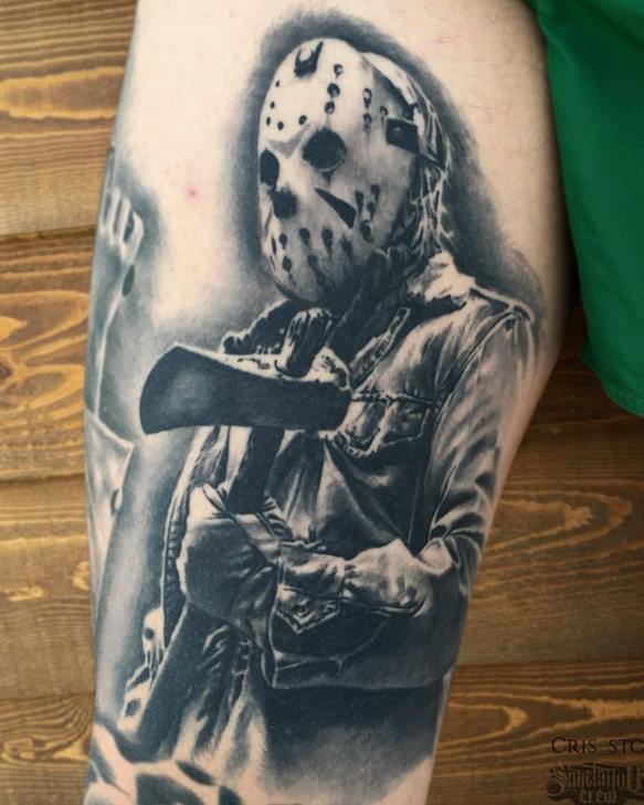 Grey Ink Jason With Axe Tattoo On Thigh