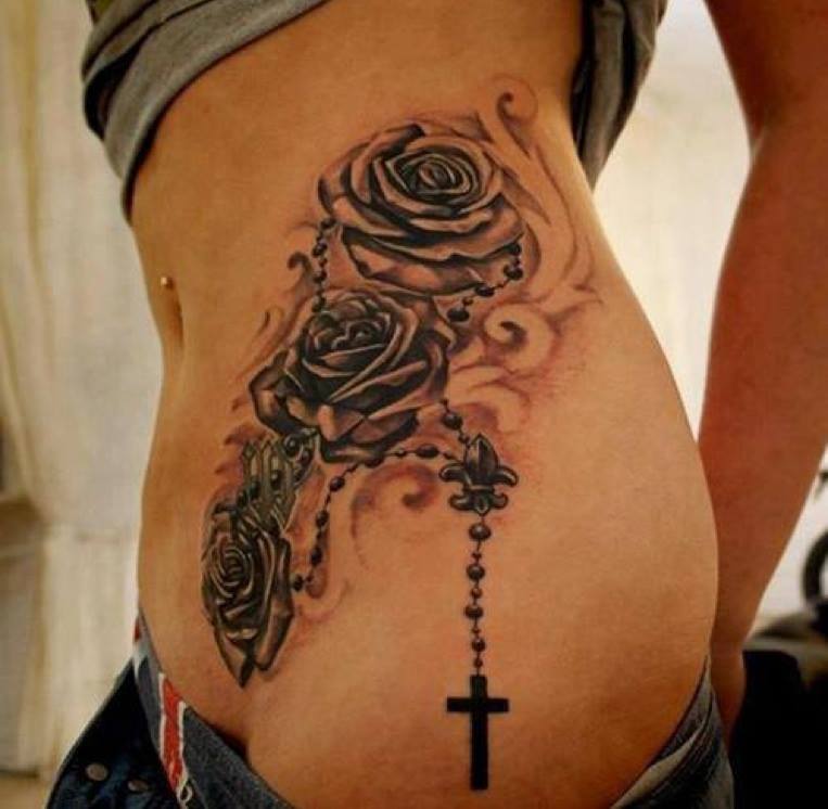 Grey Rose Flowers And Rosary Tattoo On Side Rib.
