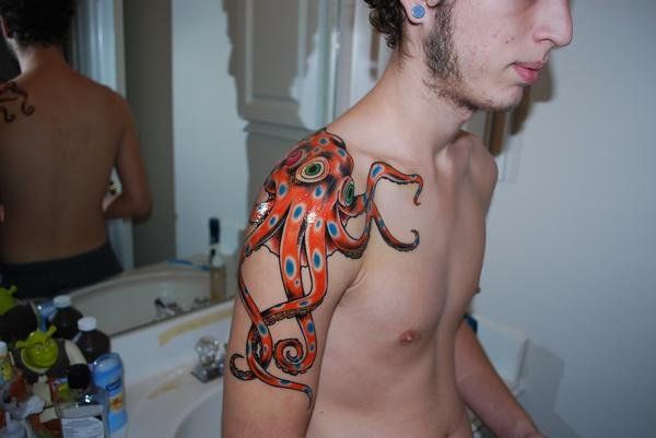 Guy With Squid Tattoo On Right Arm