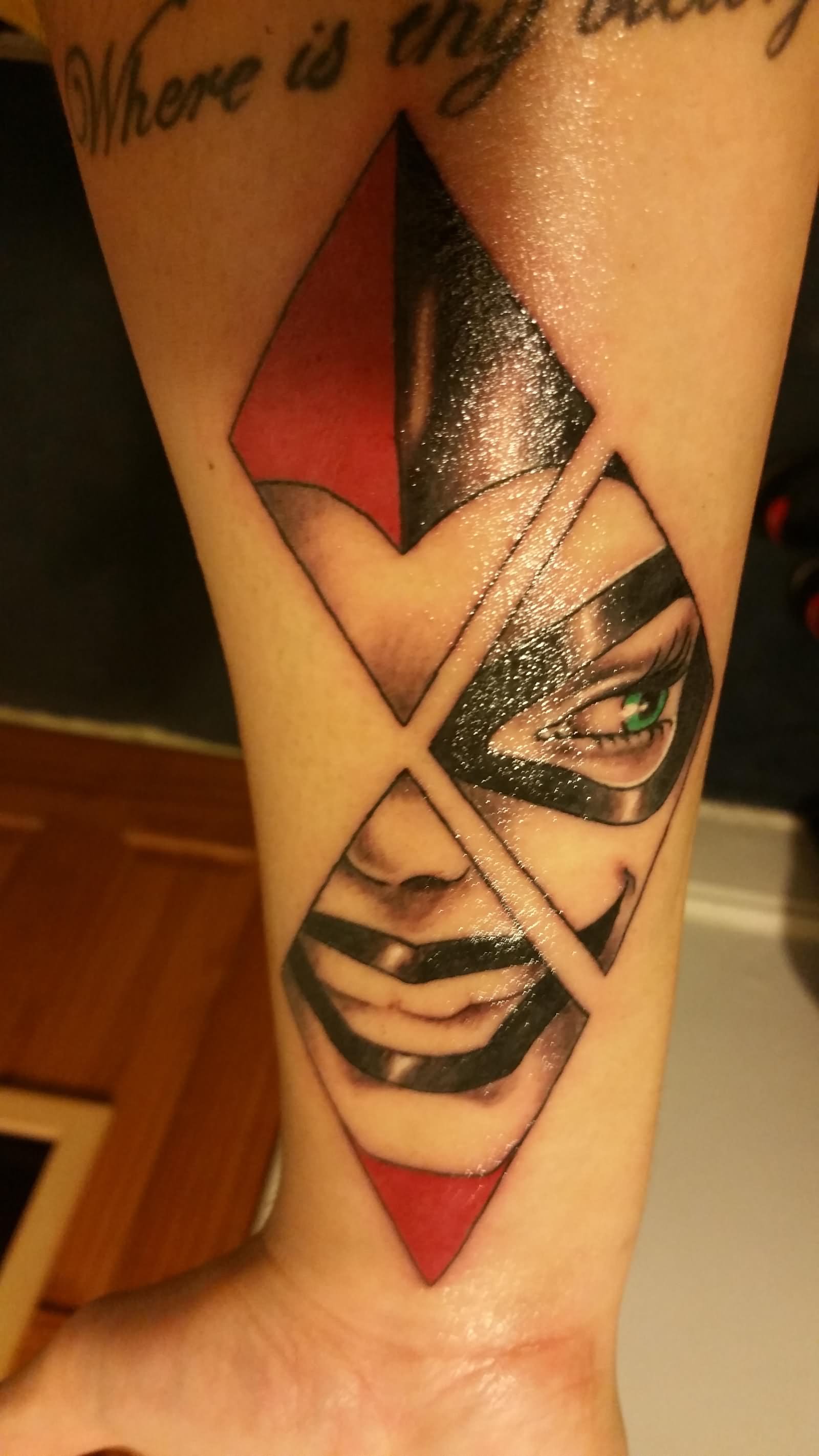 Harley Quinn Face In Diamonds Tattoo On Wrist