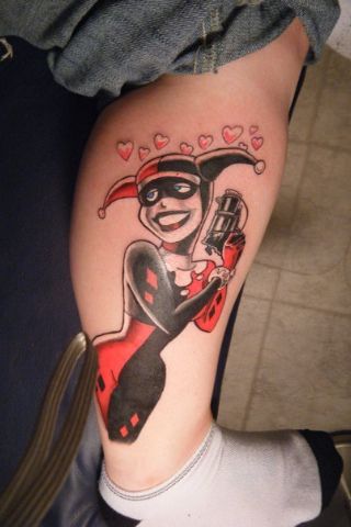 Harley Quinn With Gun Tattoo On Leg