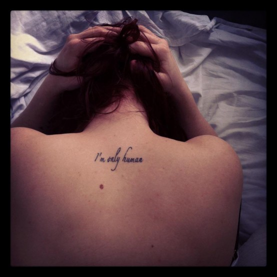 I Am Only Human Words Tattoo On Upper Back