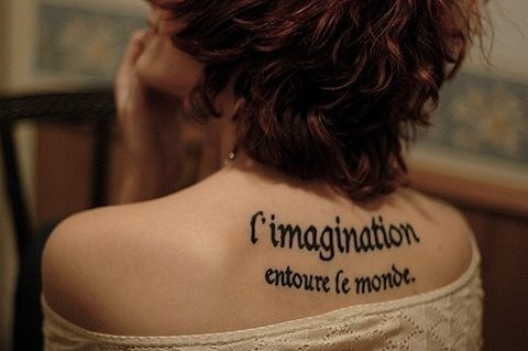 I Imagination Entoure Le Monde Words Tattoo On Girl Upper Back