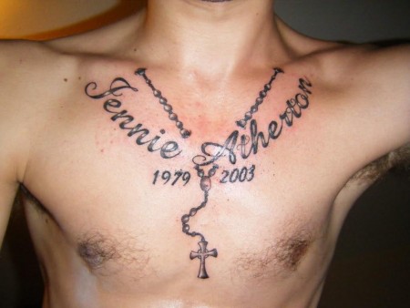 Jennie Atherton Name With Rosary Cross Tattoo On Man Chest