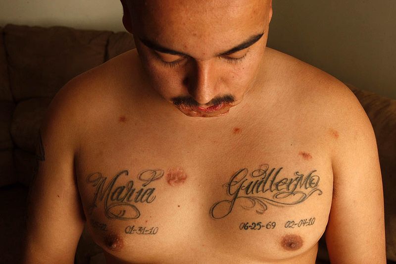 Memorial Maria And Guillermo Name Tattoo On Man Chest