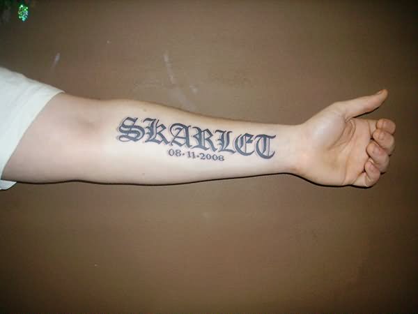 Memorial Skarlet Name Tattoo On Left Forearm