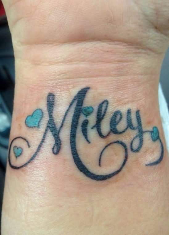Miley Name With Hearts Tattoo On Wrist