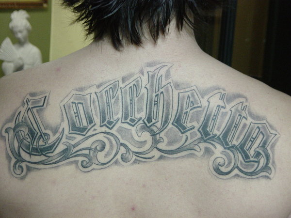 Name Tattoo On Man Upper Back By Ganesa