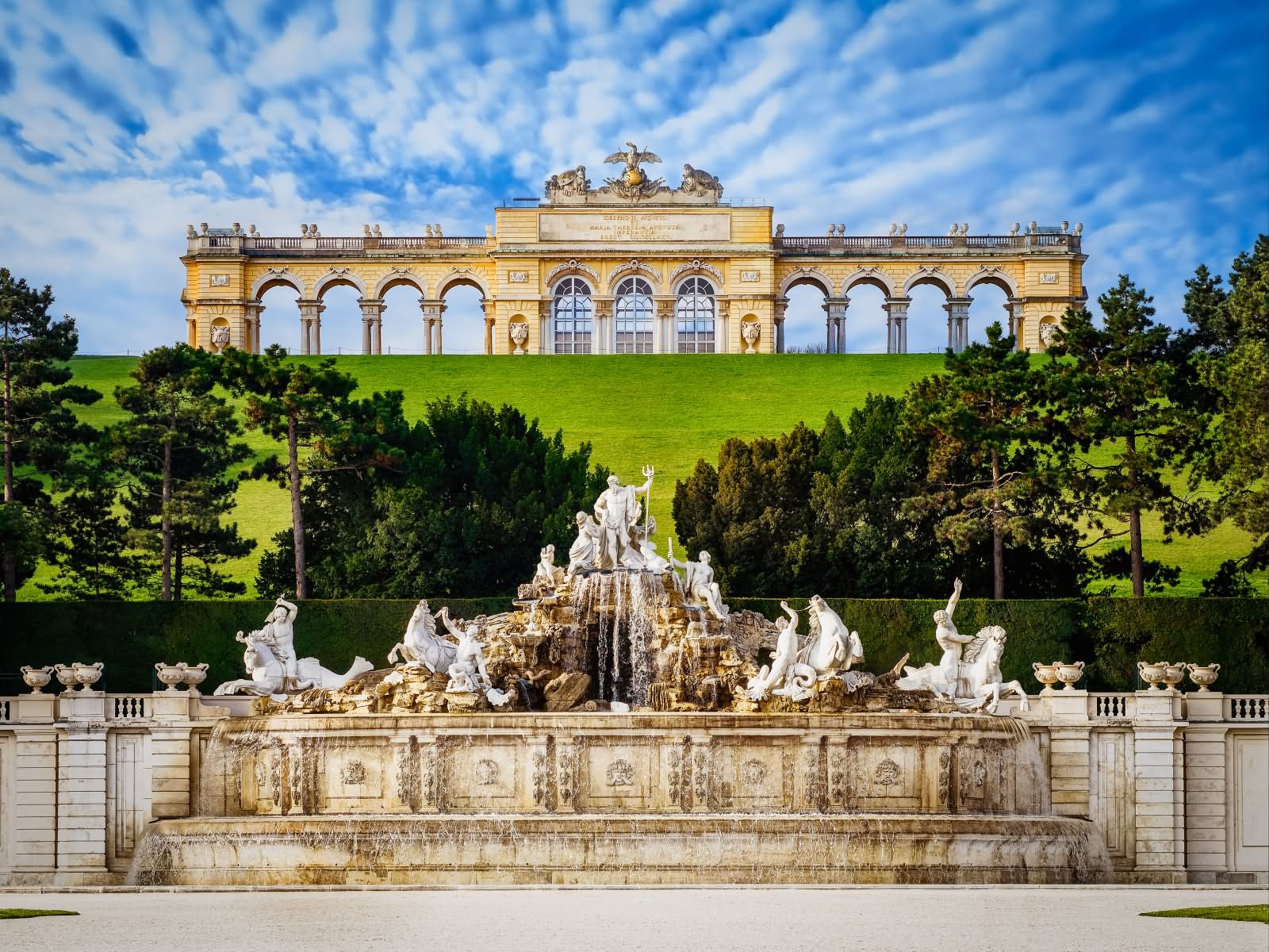 Neptune Fountain And Gloritte In The Background Of Schonbrunn Palace