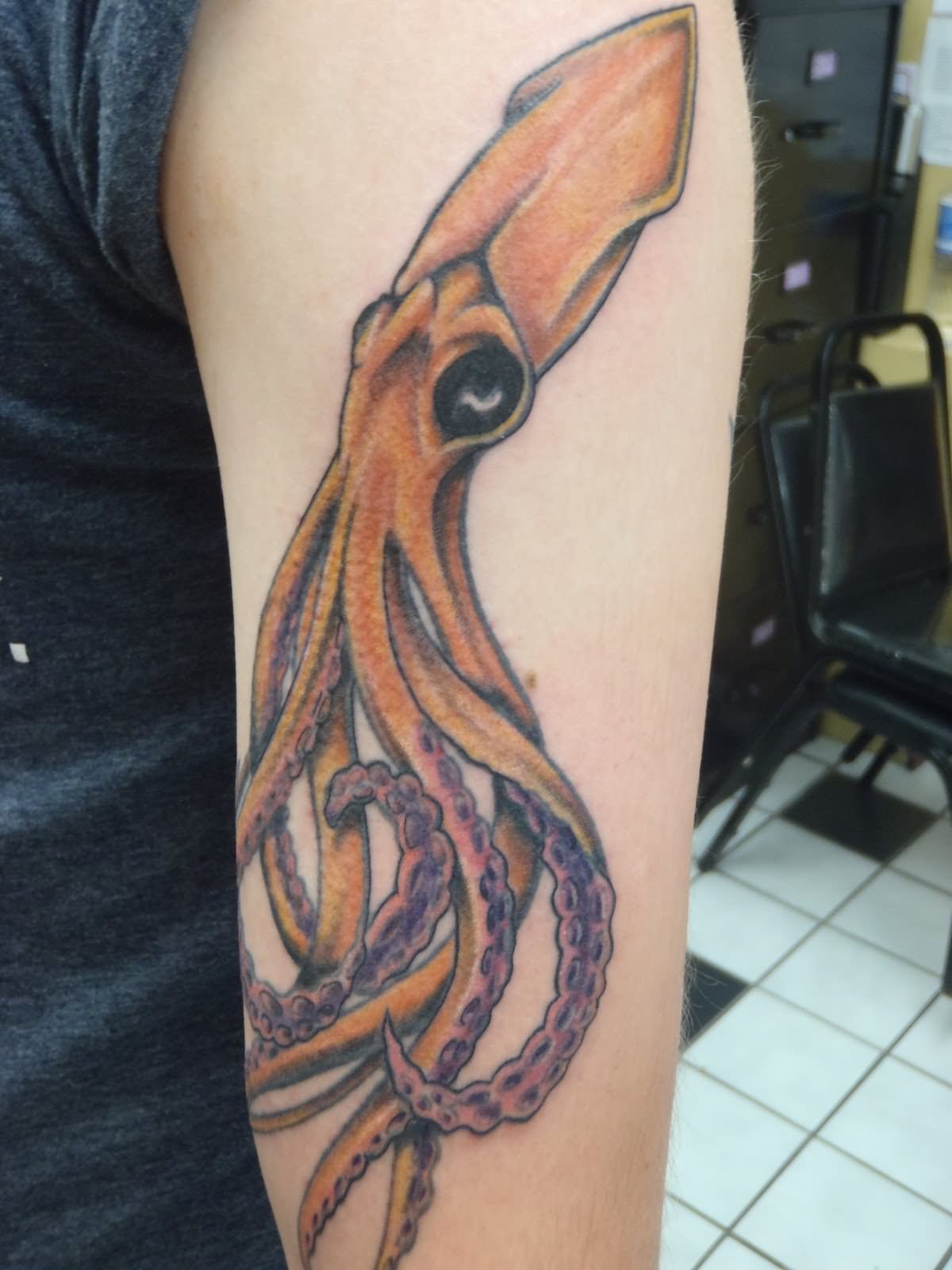 Nice Squid Tattoo On Left Arm