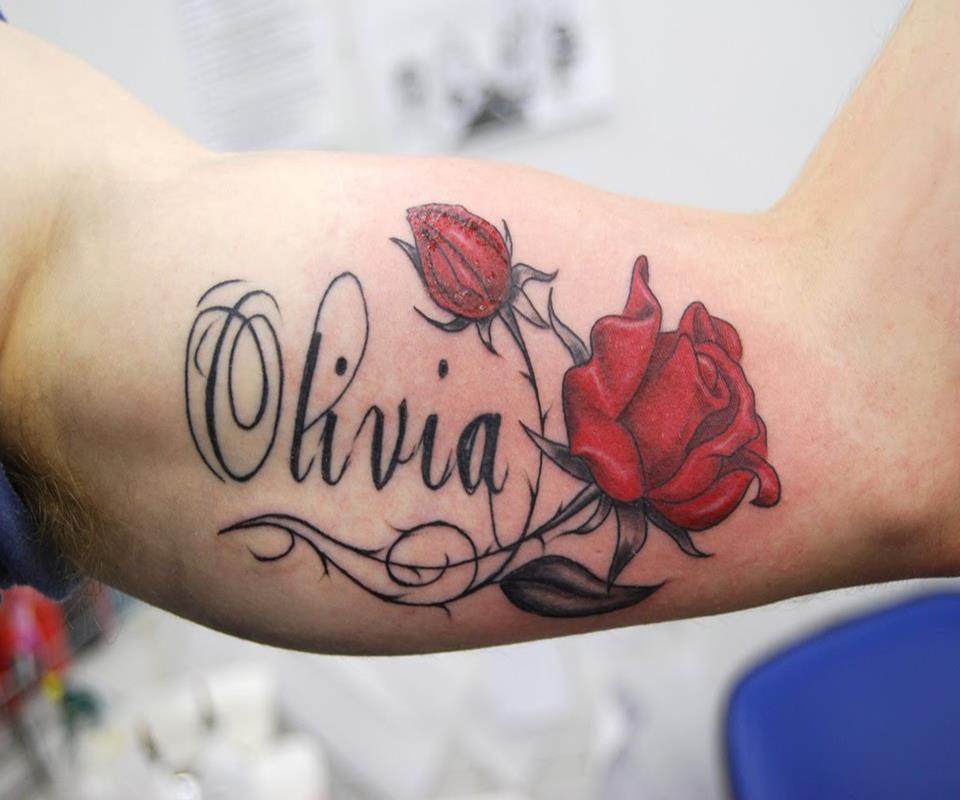 Olivia Name With Red Roses Tattoo On Bicep