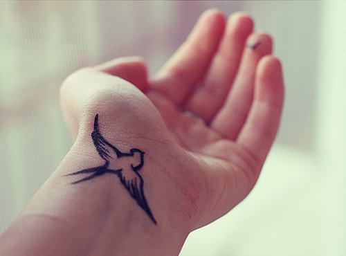 Outline Small Sparrow Tattoo On Left Wrist