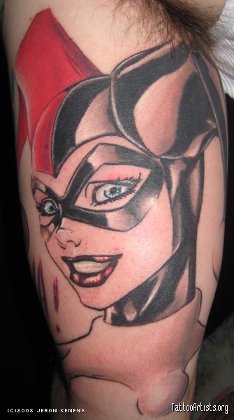 Red And Grey Harley Quinn Head Tattoo On Bicep
