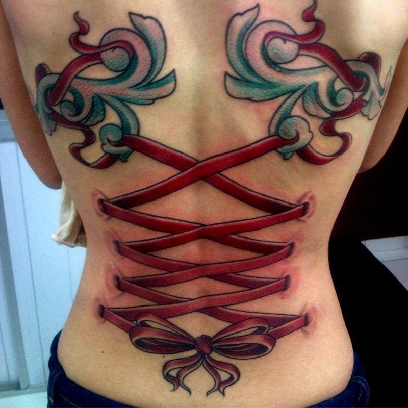 Red Ribbons Corset Tattoo On Girl Back