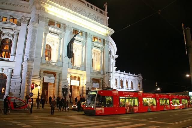 Red Tram Train Passing From The Burgtheater At Night