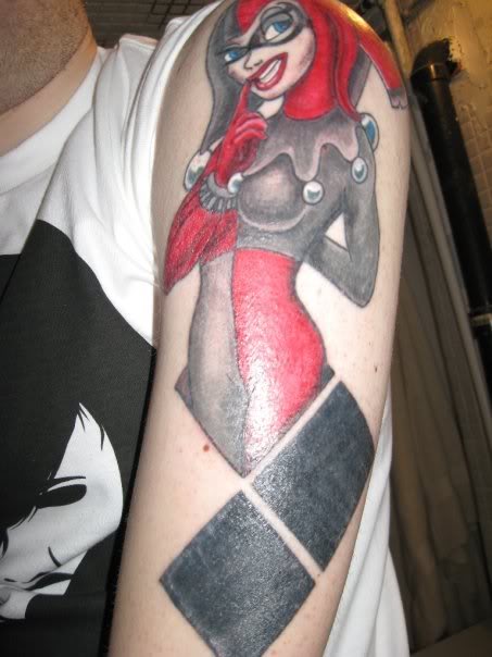 Red and Grey Harley Quinn Tattoo On Left Half Sleeve