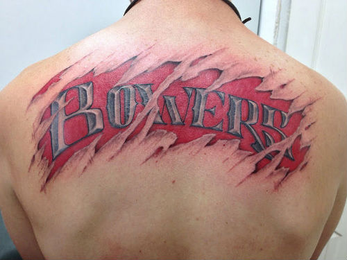 Ripped Skin Bowers Name Tattoo On Man Upper Back