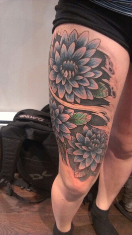 Ripped Skin Dahlia Flower Tattoo On Right Thigh