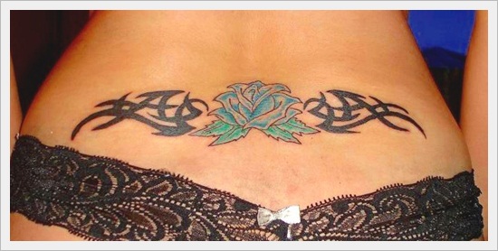 Rose With Tribal Design Tattoo On Girl Lower Back