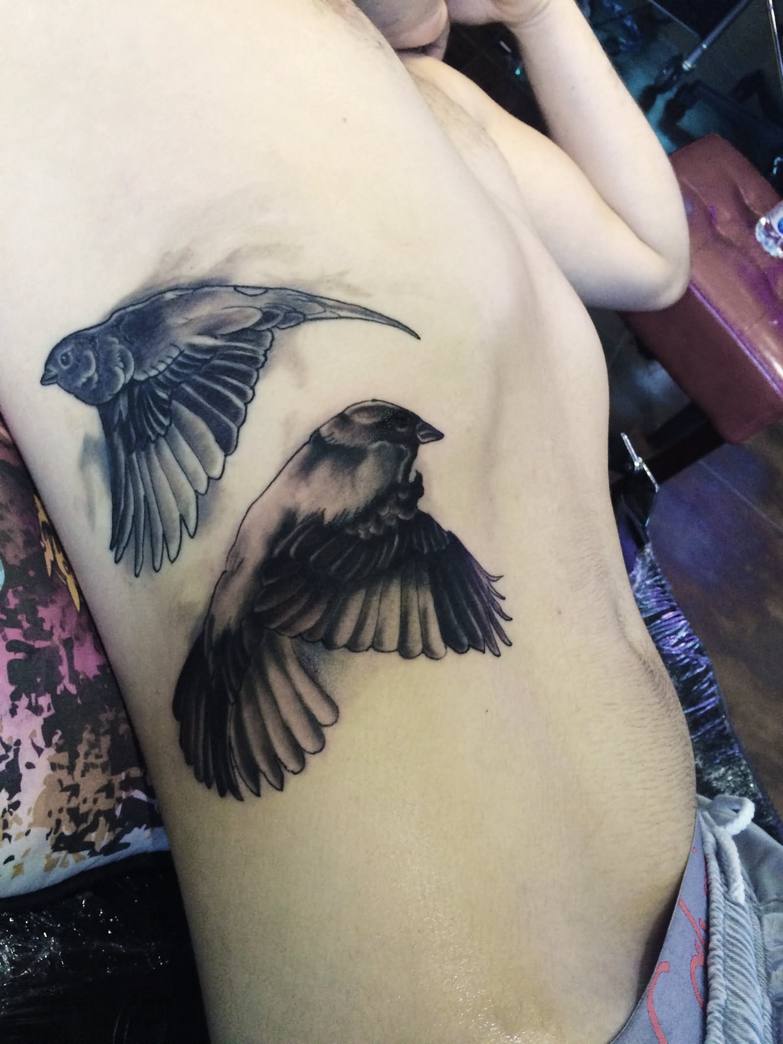 Side Rib Black Ink Sparrow Tattoos