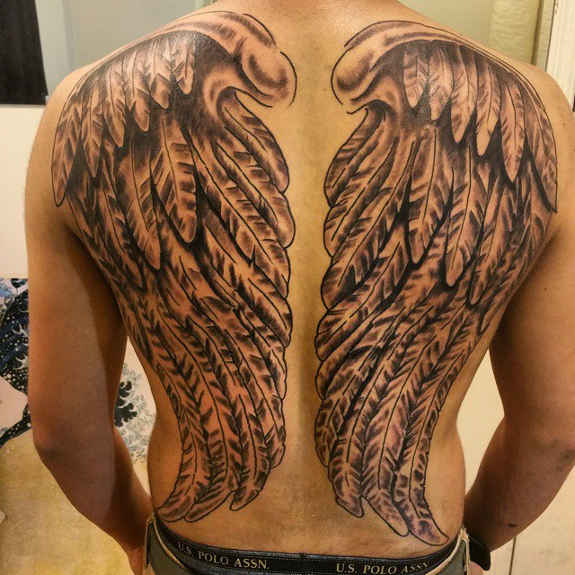 Simple Black Ink Wings Tattoo On Full Back