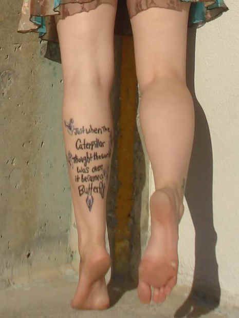 Simple Quote Tattoo On Girl Left Leg Calf