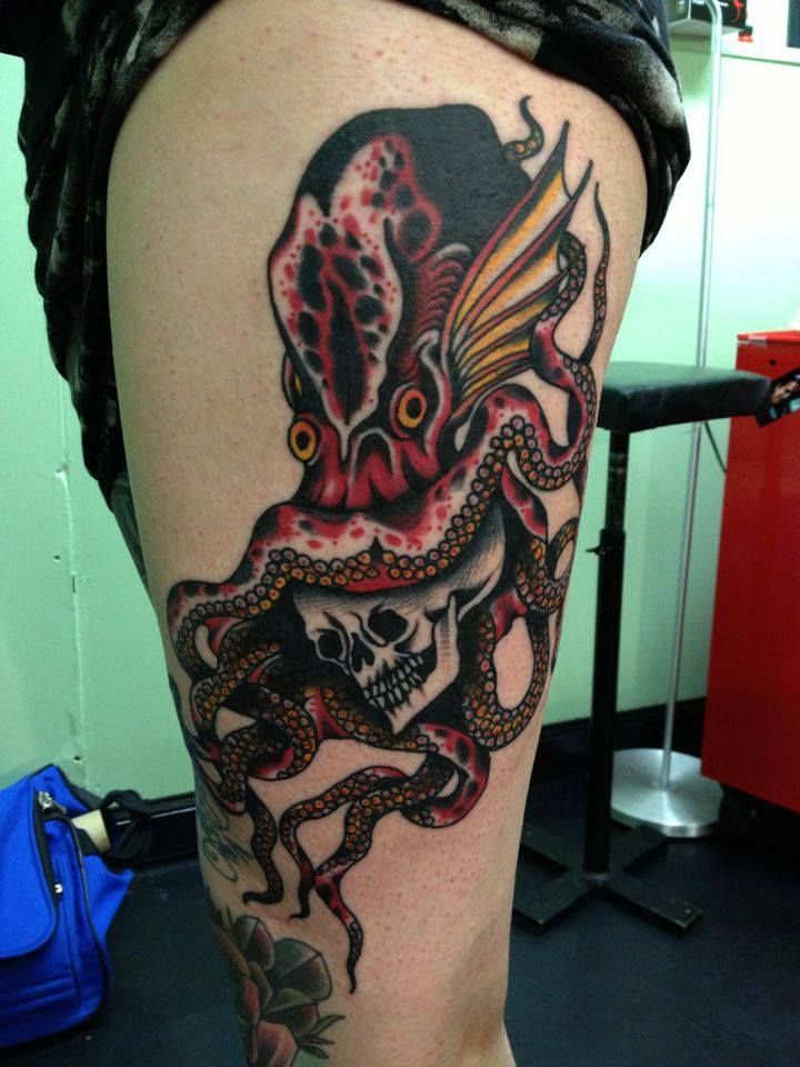 Skull And Traditional Squid Tattoo On Left Thigh