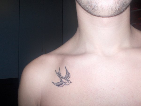 Small Sparrow Tattoo On Front Shoulder