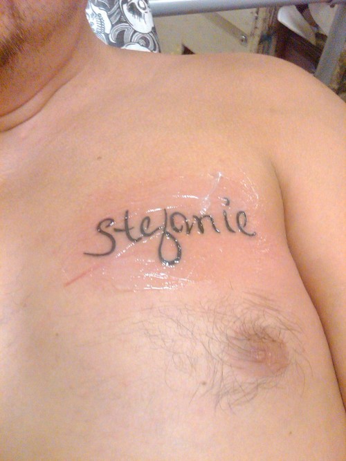 Stefanie Name Tattoo On Man Chest