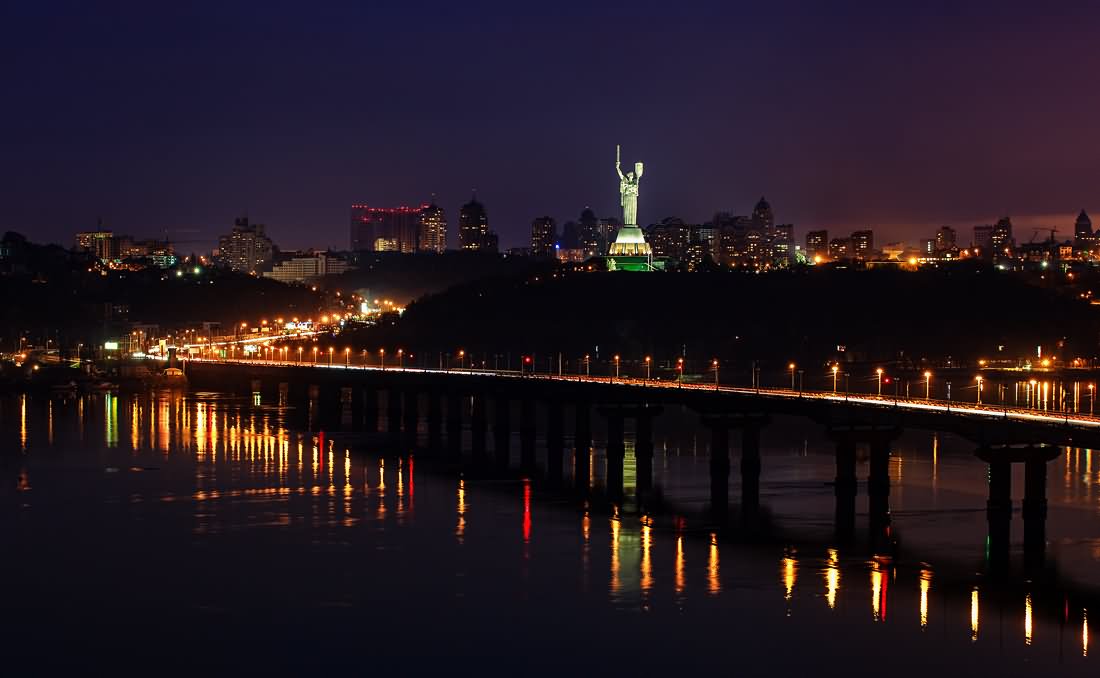 The Mother Motherland Monument Behind Paton Bridge At Night