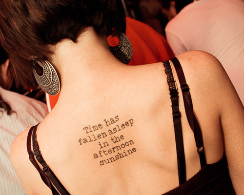 Time Has Fallen Sleep In The Afternoon Sunshine Words Tattoo On Girl Upper Back