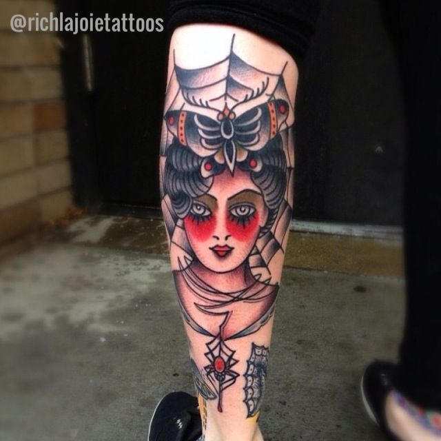 Traditional Girl Face Tattoo On Left Leg Calf